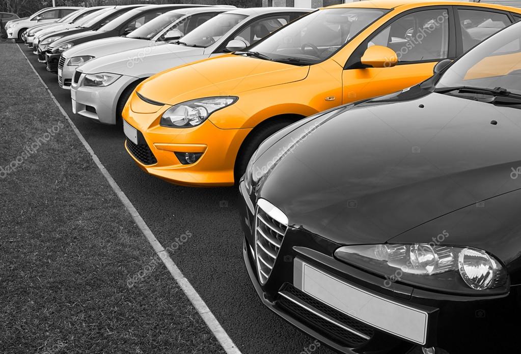 The perfect new car of your choice selected from a row of different european marques of used cars for retail sale on a motor dealers forecourt all logos removed