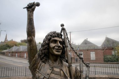 Bon Scott Statue, Kirriemuir, Scotland, UK. Ronald Belford Bon Scott was a Scottish-born Australian singer and songwriter, best known for being the lead vocalist and lyricist of the Australian hard rock band AC/DC from 1974 until his death in 1980 clipart