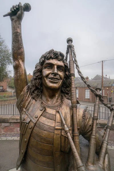 Bon Scott Statue, Kirriemuir, Scotland, UK. Ronald Belford Bon Scott was a Scottish-born Australian singer and songwriter, best known for being the lead vocalist and lyricist of the Australian hard rock band AC/DC from 1974 until his death in 1980