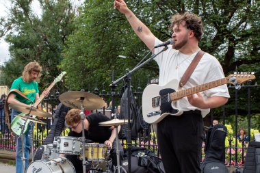 High Fade band performs on Princes Street during Edinburgh Festival Fringe 2022- 5 Aug-29 Aug, Edinburgh UK. Actors of street theater and musicians in capital of Scotland. Art on the street 