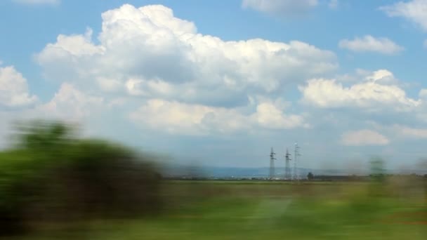 Paisaje disparado desde un coche en movimiento — Vídeos de Stock