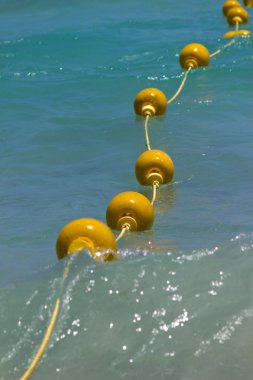 Yellow buoys in the sea clipart