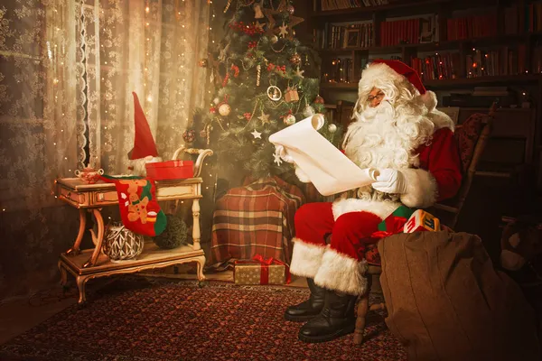 Santa Claus reading from a Christmas wish list