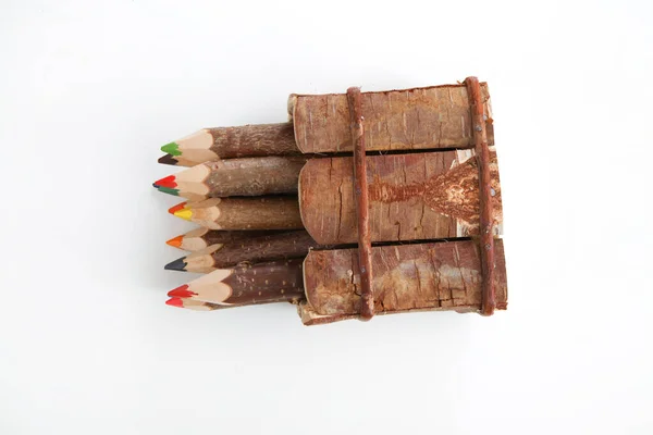 colourful pencils natural wood on white background studio top view