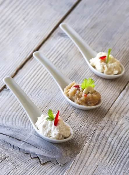 Assortment of dips on a wooden table — Stock Photo, Image