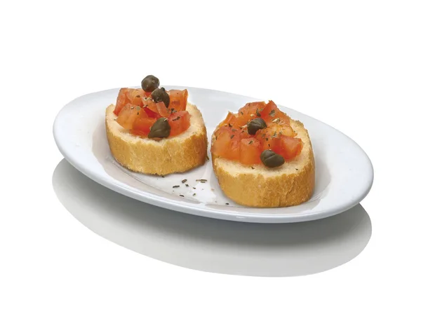 Two Bruschetta Chopped Tomato Caper Oregano White Plate Studio Shot — Stock Photo, Image