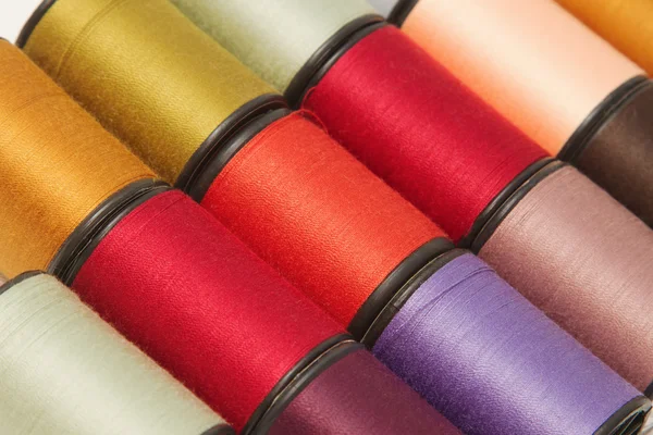 Sewing threads multicolored background — Stock Photo, Image