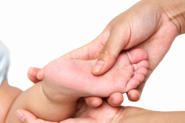 Mother Massaging Little Baby 's Foot — стоковое фото