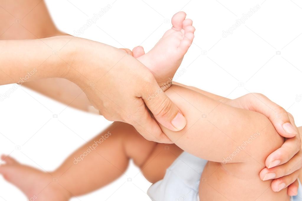 Mother hand massaging leg and foot muscle of her baby,touch of