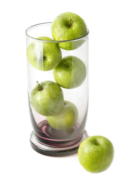 Green apple in glass bowl — Stock Photo, Image