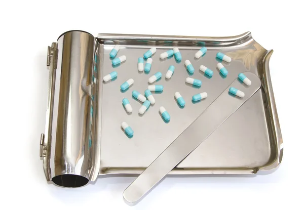 A stainless pill counter with capsule tablet — Stock Photo, Image