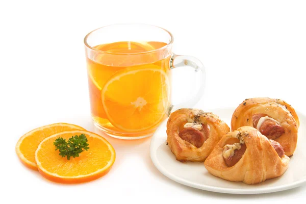 Tea break, orange tea with little croissant — Stock Photo, Image