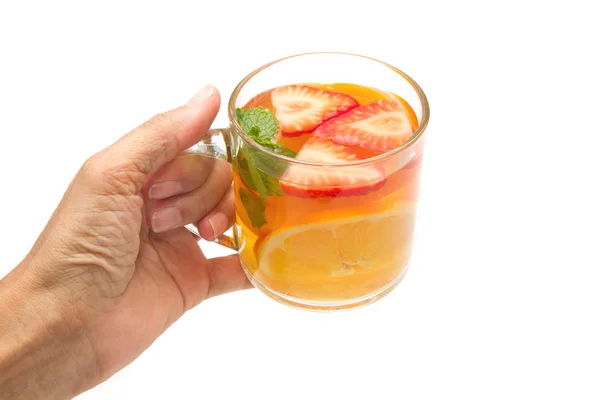 Mano de mujer con té de frutas en aislado —  Fotos de Stock