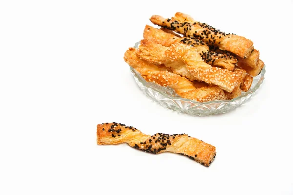 Sweet puff pastry sticks with sesame seeds — Stock Photo, Image
