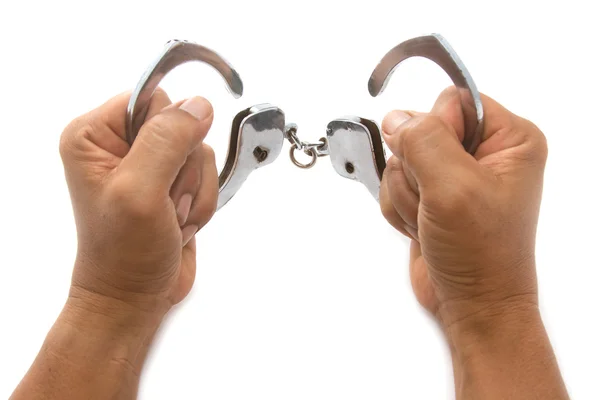 Открытые наручники с рукой — стоковое фото