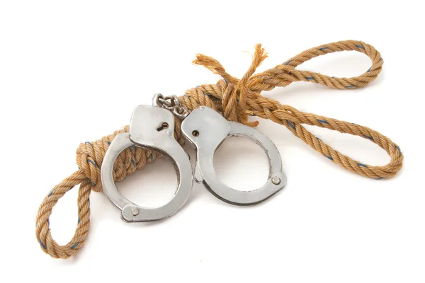 Manila rope with hand cuffs — Stock Photo, Image