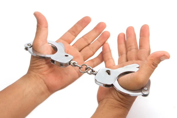 Handcuffs with hand — Stock Photo, Image
