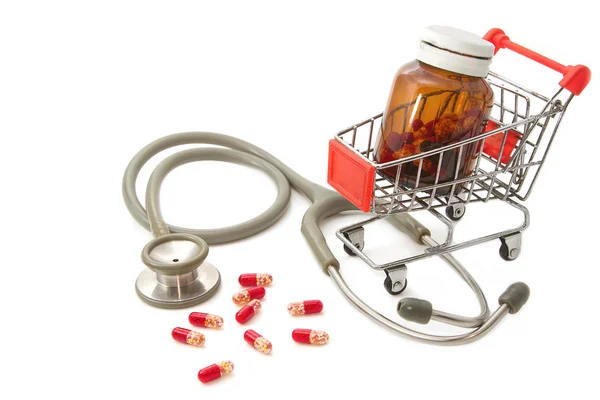 Shopping Cart with capsules and a stethoscope — Stock Photo, Image