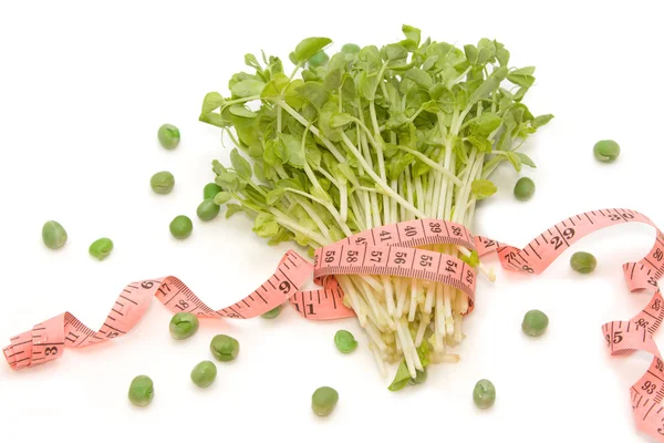 Snow Pea Sprouts with measuring tape (dieting concept) — Stock Photo, Image