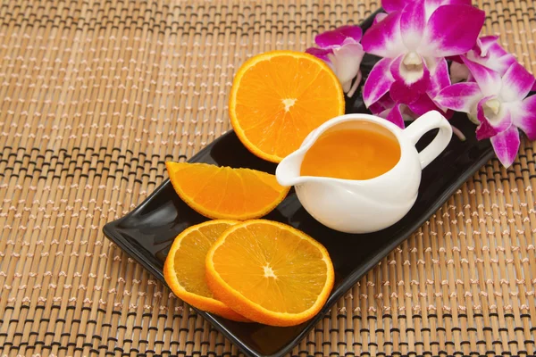 Orange juice and fresh fruit on wooden table — Stock Photo, Image