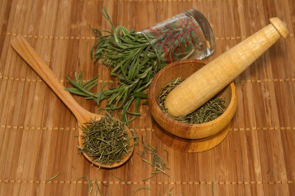 Rosemary product, mortar with fresh and dried rosemary — Stock Photo, Image