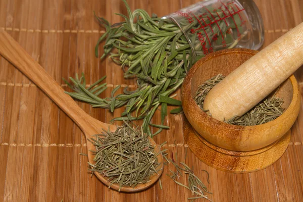 Rosemary product, mortar with fresh and dried rosemary — Stock Photo, Image