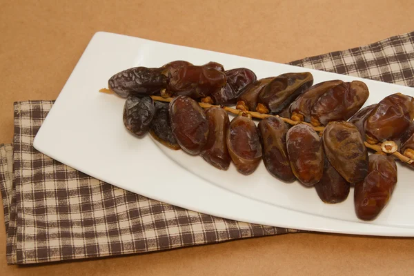 Date fruits in white plate — Stock Photo, Image