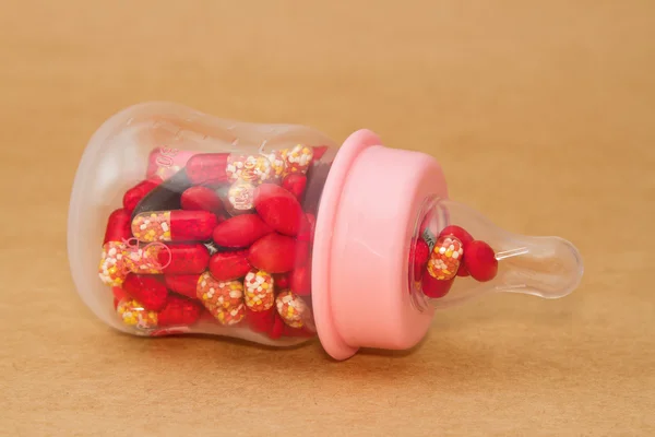 Pills in baby bottle — Stock Photo, Image