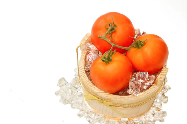 Fresh tomato on ice — Stock Photo, Image