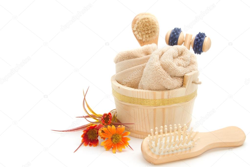 Wooden bucket with SPA accessories isolated