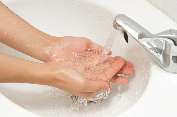 Washing hands under flowing tap water — Stock Photo, Image