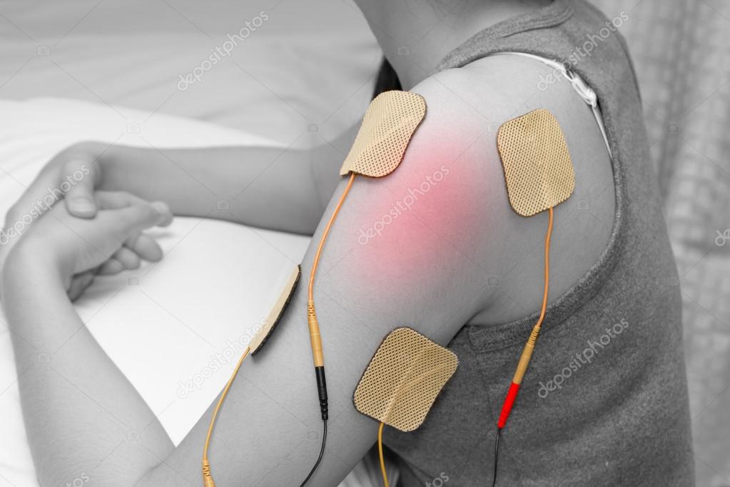 Muscle stimulator with electrodes, bacBack and shoulder massage with a muscle  stimulator with attached electrodes along the spine. 13725631 Stock Photo  at Vecteezy