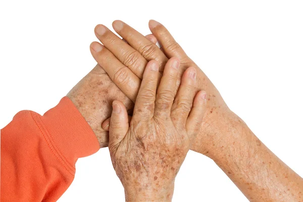Eldre par som holder hverandre i hånden – stockfoto