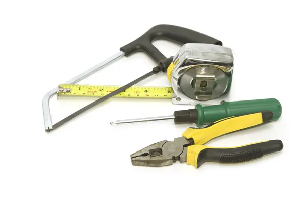 Carpenter tools  with  saw pliers  screwdriver and measuring tap — Stock Photo, Image