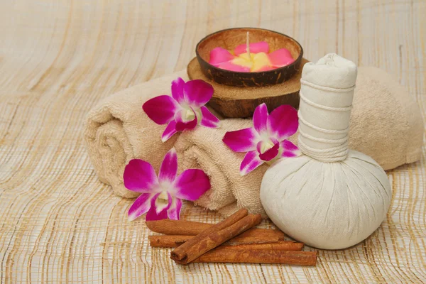 Spa massage setting with herb, towel, compress balls and aroma c — Stock Photo, Image