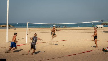 Young people gathered to play volleyball with their feet on the city beach. Israel Ashkelon November 2020