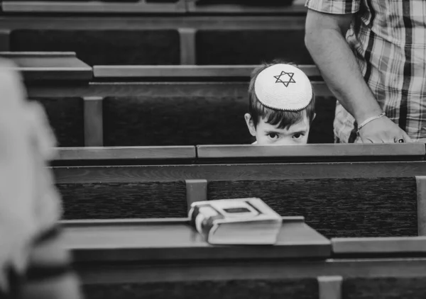 Bar Mitzvah celebration in the city synagogue. Portrait of a boy who is at the bar mitzvah ceremony. Israeli village Shlomi June 29, 2022