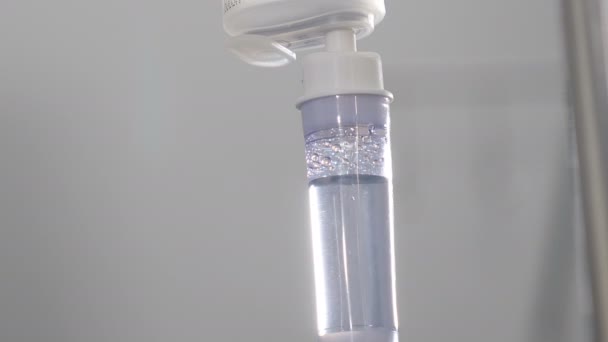 Infusion dripping. Medical IV Drop Rate. medical dropper close up. Drop counter with medicine. Transparent dropper with medical liquid dribbling down in hospital ward. treatment of patients — Stockvideo