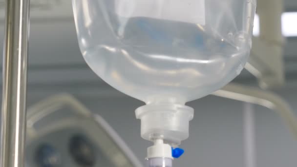 Infusion dripping. Medical IV Drop Rate. medical dropper close up. Drop counter with medicine. Transparent dropper with medical liquid dribbling down in hospital ward. treatment of patients — Stock video