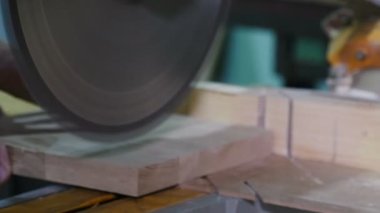 Electric Saw Machine Blade and Board at furniture factory. circular saw spinning on woodworking machine. woodworking industry. electric wood saw. production of wooden furniture. 4 k video