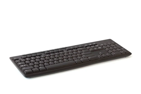 美国英语排版语言在白色背景下隔离的黑色无线键盘包括裁剪路径和软阴影 — 图库照片