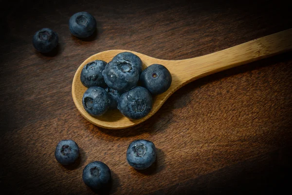 Blueberries on a Wooden Spoon — Stock Photo, Image