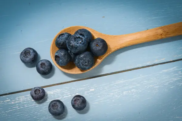 Blueberries on a Wooden Spoon — Stockfoto