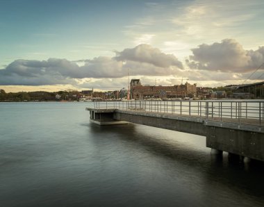 Long exposure image of a jetty in west coast of gothenburg, Sweden with city in the background