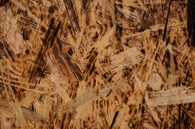 Tütsülenmiş yonga (fiberboard) dokusu. Tahta malzeme. Seçici odaklanma. Üst görünüm.