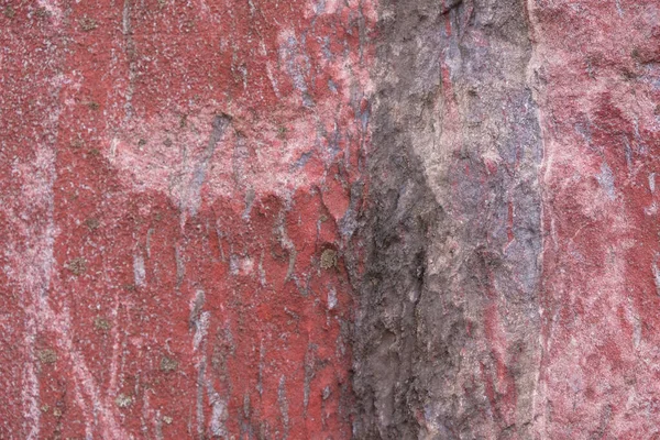 Kırmızı taş arka plan. Dekoratif etki. Kısmi bulanıklaşma.