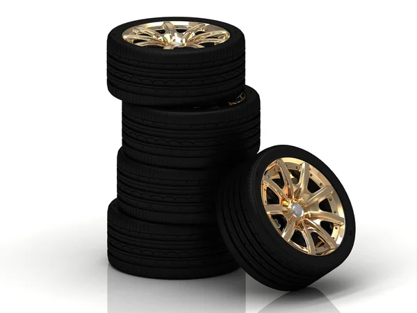 Five black wheels with gold discs — Stock Photo, Image