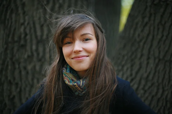 Smiling girl in autumn park Stock Picture