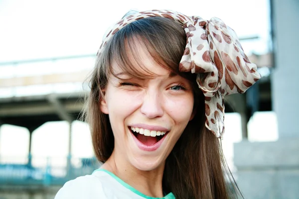 Winking woman with kerchief — Stock Photo, Image