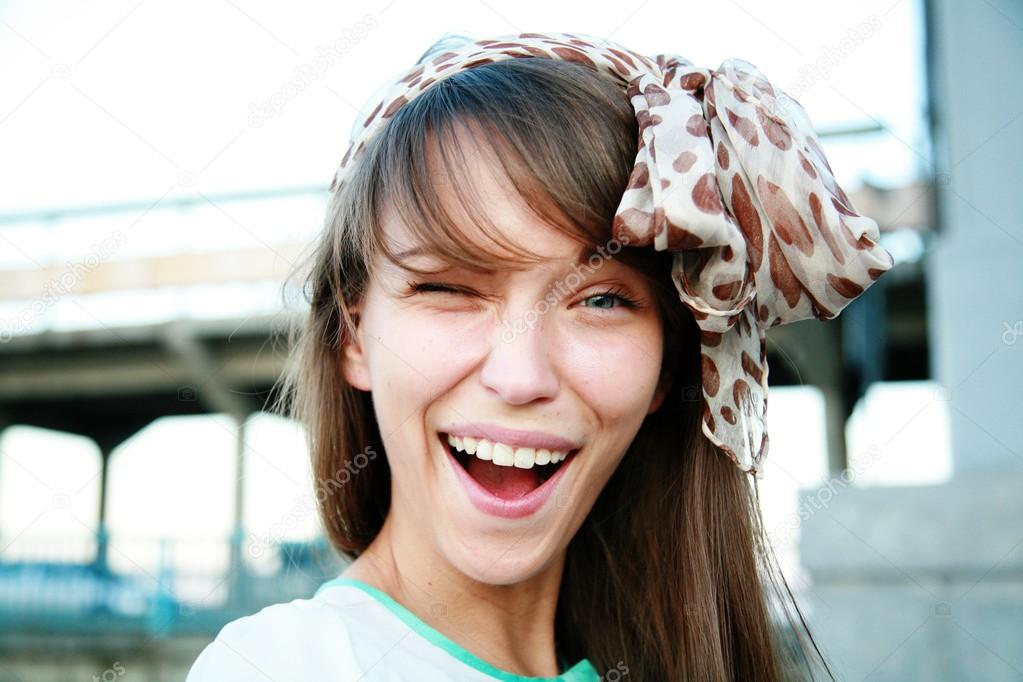 Winking woman with kerchief